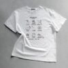 Weißes T-Shirt mit einer Illustration von Nähutensilien und dem Schriftzug Sew Obsessed, entworfen von der Künstlerin Anke für Cherry Picking.